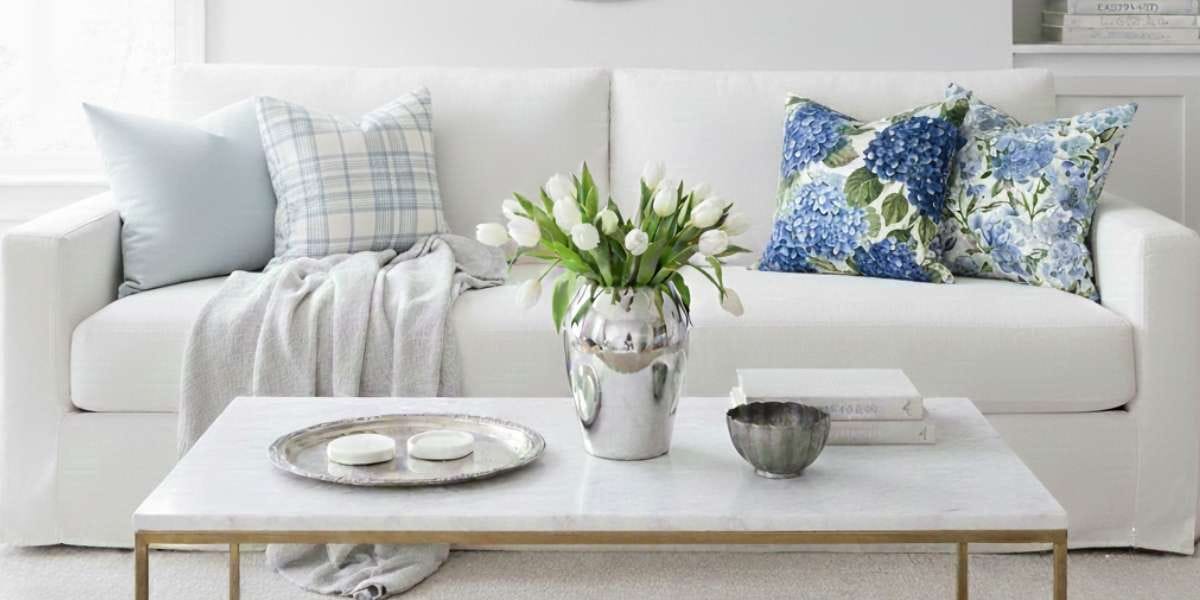 Mixing chrome fixtures with antique silver home decor in a modern heritage living room.