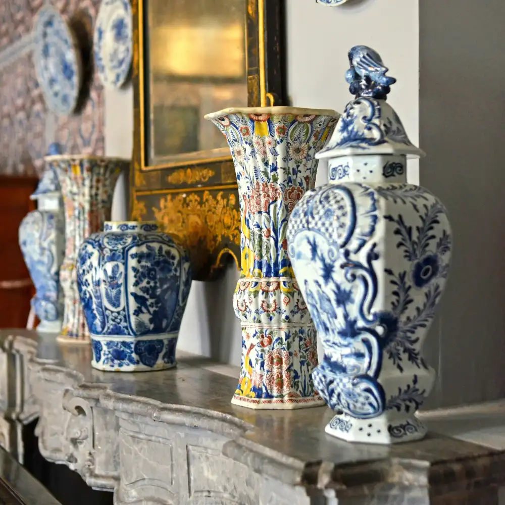 blue and white ginger jars on mantle